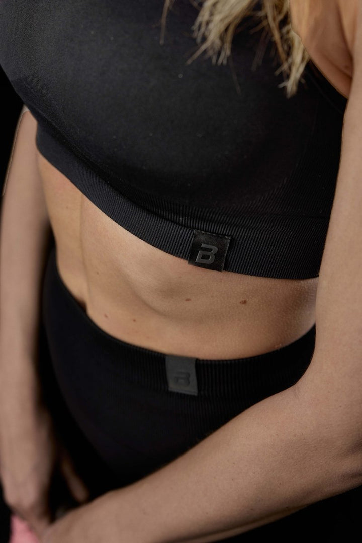Seamless sportmelltartó